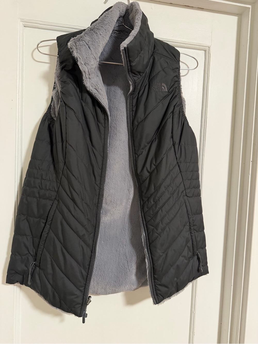 The North Face Women’s Black Quilted Vest with Gray Fleece Lining